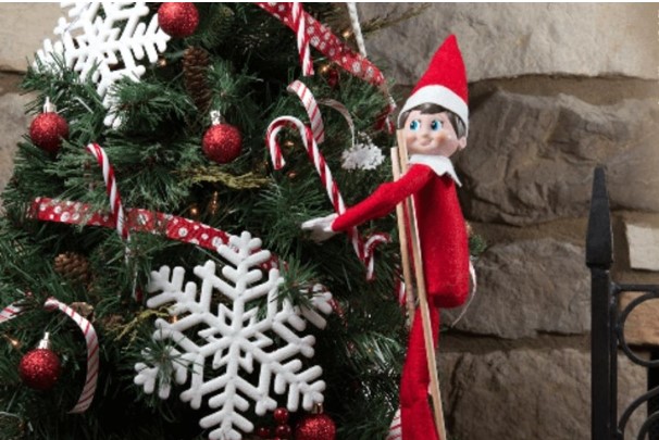 elf decorating Christmas tree