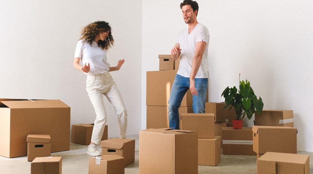 A couple packing their stuff for moving