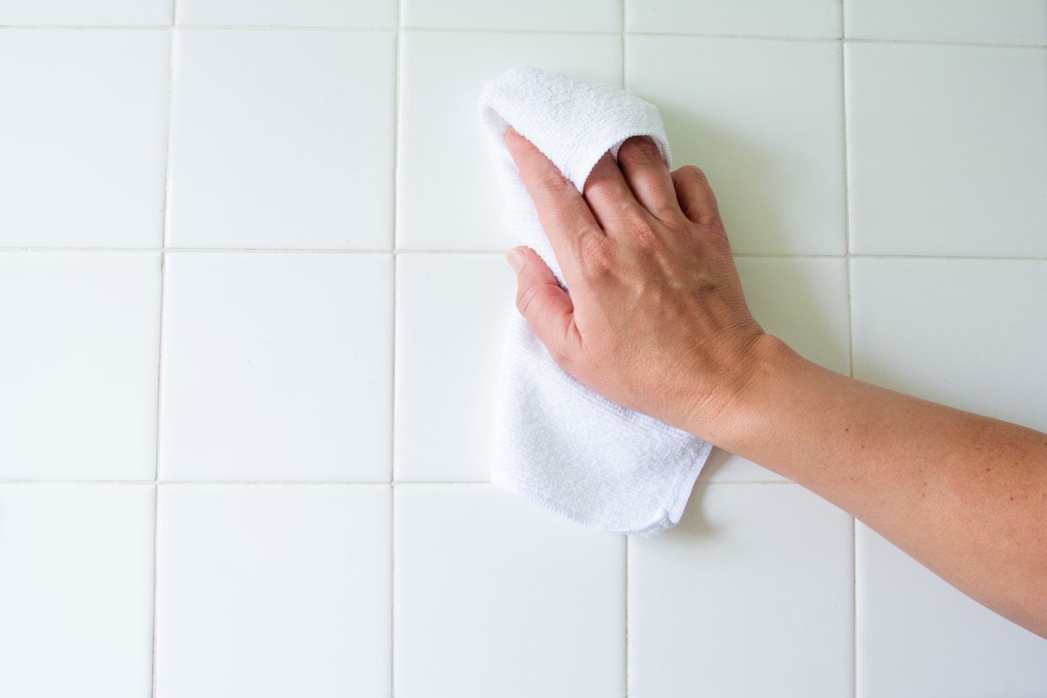 Dry the tiled area with an old towel