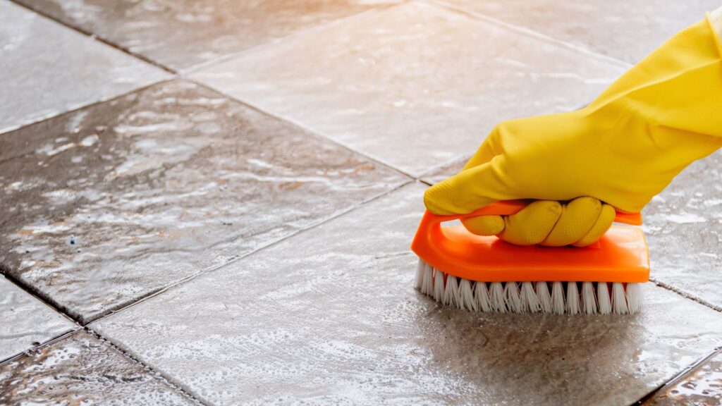Scrub the grout lines with your brush