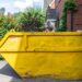 big yellow rubbish skip bin