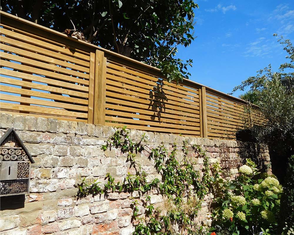 bottom of fence gap ideas with brick wall