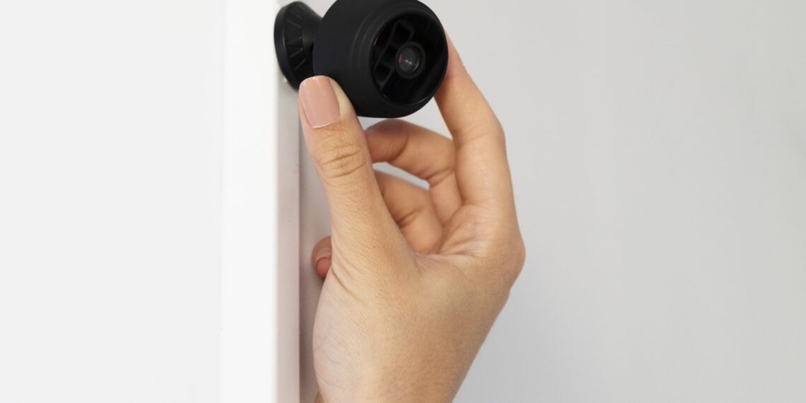 close-up hand holding camera