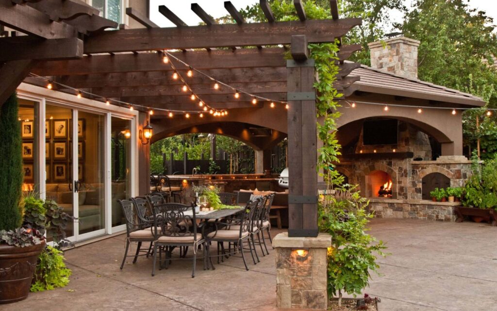 outdoor kitchen pergola with string lights