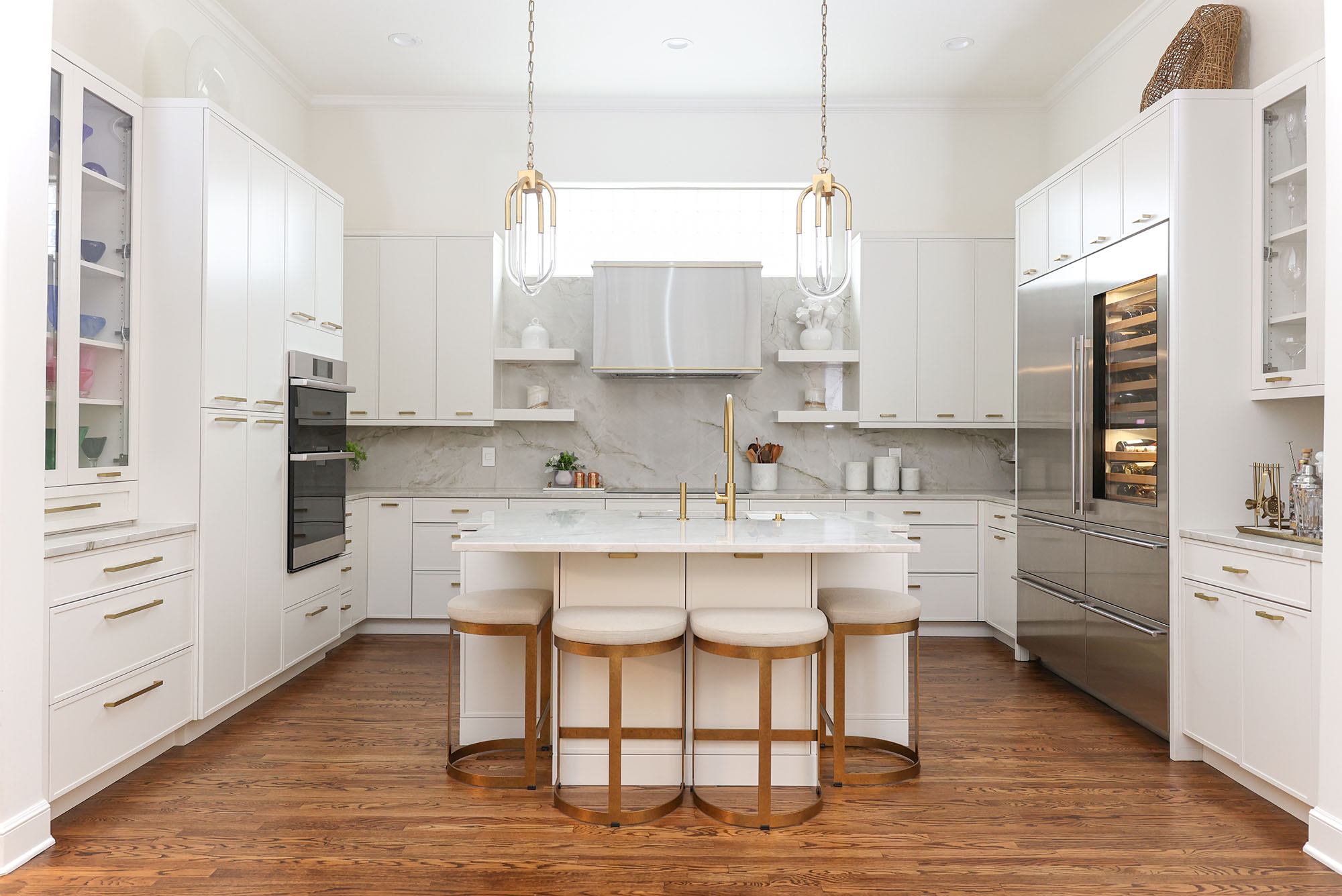 white kitchen island with chairs