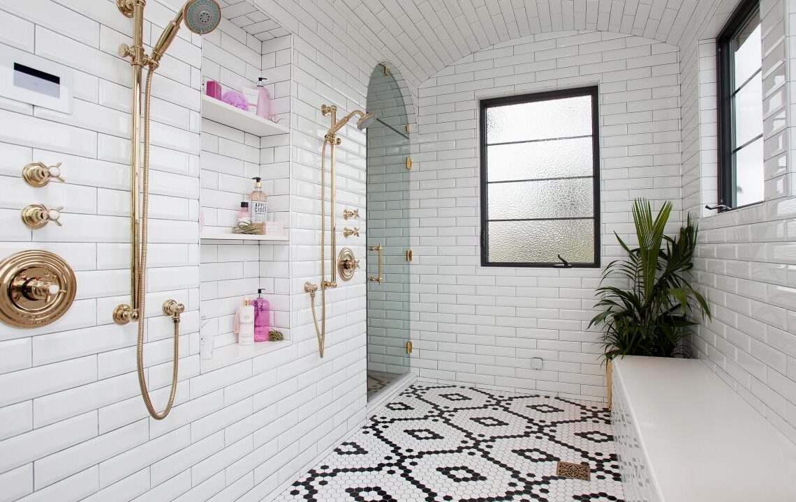 white tiles with copper fixture walk in shower tile ideas